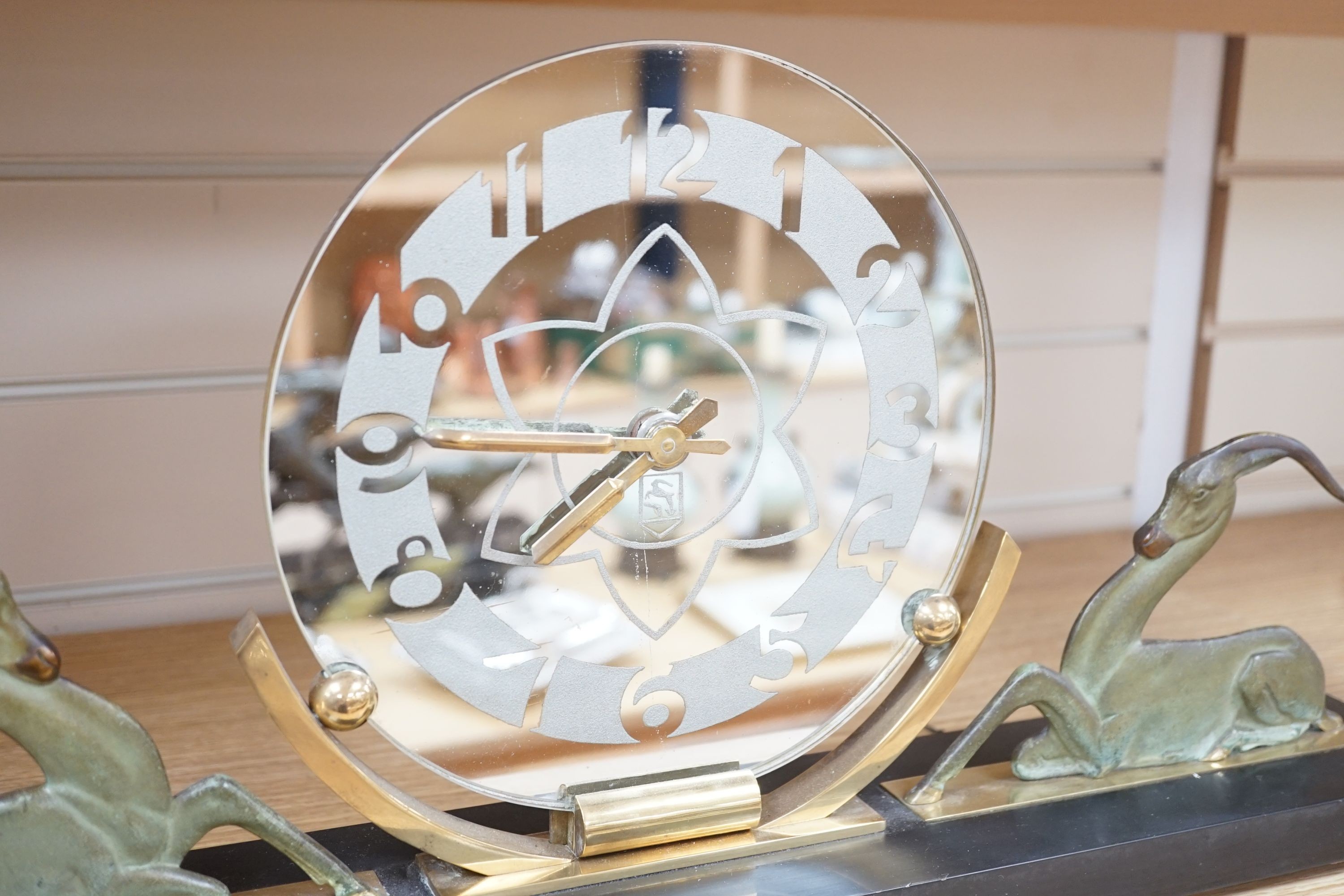 An Art Deco bronze and black slate ‘antelope’ mantel timepiece, 62cm